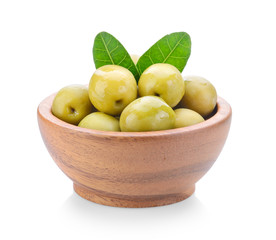 green olives in wood bowl on a white background