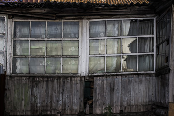 old abandoned house, wooden building with a  window