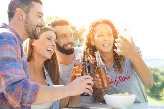 Group of friends having fun taking selfie pictures