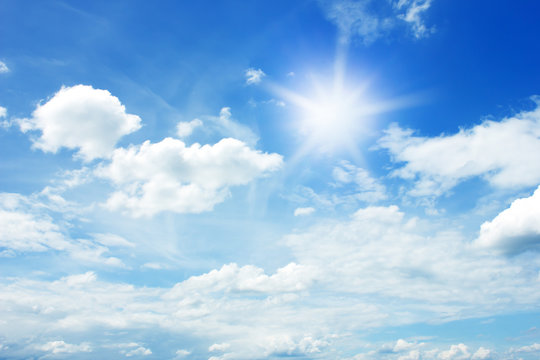 sun and clouds in the blue sky background