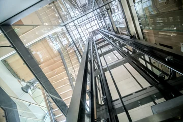 Fotobehang transparent lift modern elevator shaft glass building © Luca Lorenzelli