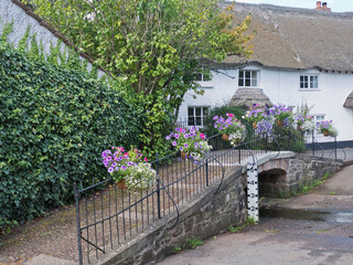 Footbridge over a ford on the edge of a Devon village UK © pjhpix