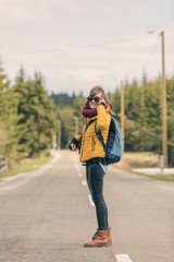 Cute smiley girl posing on a empty suburb road.