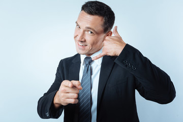 Delighted positive man pointing at you