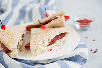Club sandwich with meat, cucumber and cream cheese