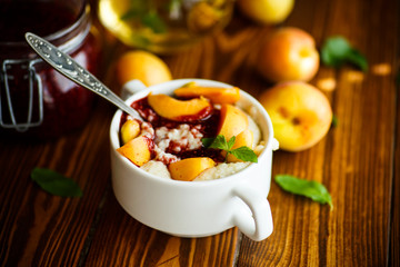 Oatmeal with jam and fresh apricots