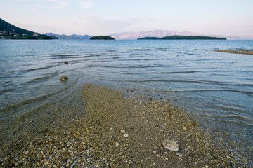 Coastline with gravel beach and sea surface
