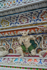 Traditional Thai style sculptures and painting of monster,animals and gods in church under decoration of Wat Pariwat