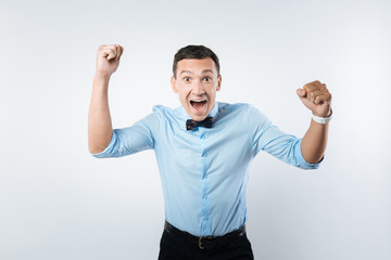 Fototapeta premium Happy delighted man showing his emotions