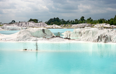 Man-made artificial lake Kaolin and white land containing kaolinite covered with rain water, forming clear blue lake, Air Raya Village, Tanjung Pandan, Belitung Island.