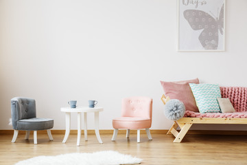 Grey poster above sofa