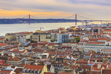 Fototapeta na wymiar View to the downtown Lisbon with the bridge and Tagus river as background