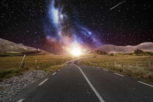 asphalt road over night sky or space