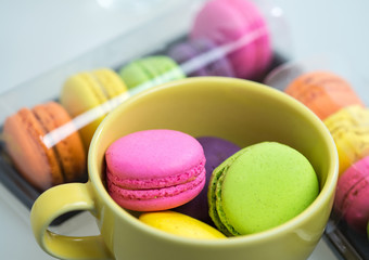 Close up colorful macarons dessert with vintage pastel tones