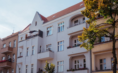buildings in berlin with tree on the side