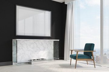 Black living room, fireplace and blue armchair