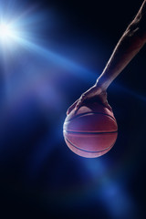 Obraz premium The portrait of a basketball player with ball