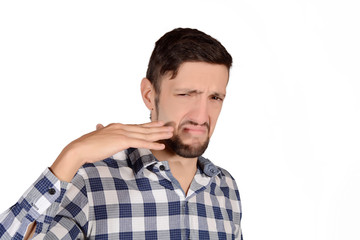 Man holding nose against bad smell.