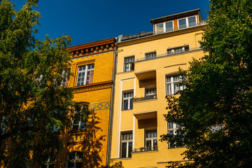 Fototapeta na wymiar high contrasted and warm colored houses