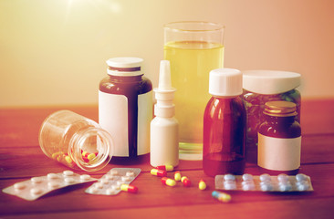 medicine and drugs on wooden table