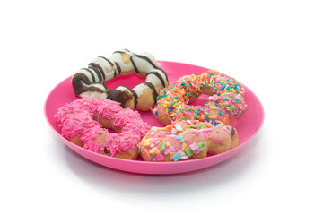 colorful doughnut on pink plate