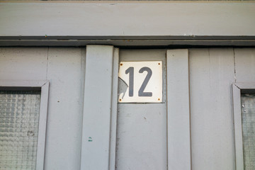 number twelve on grey door