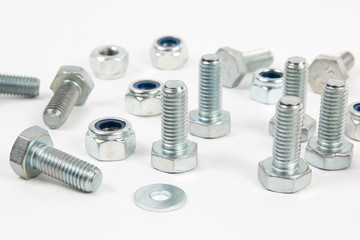 steel metal bolts and nut on a white background