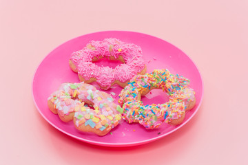colorful doughnut on pink plate