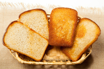 Fried toast on a white wooden background