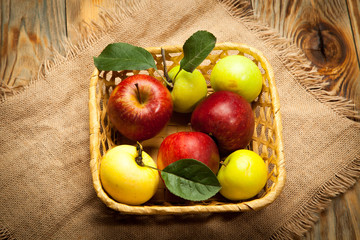 Fresh red apples in the wooden box. On wooden background. Free space for text . Top view