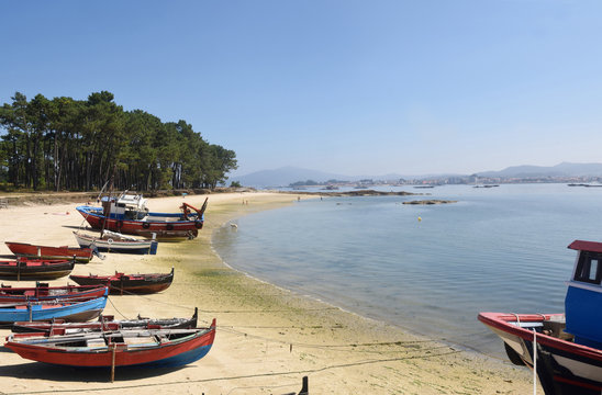 Arousa Island boats on the beach Praia Cabodeiro, Pontevedra province, Galicia, Spain