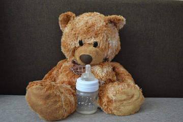 Toy bear. Baby bottle
