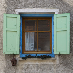 Old window with open shutters