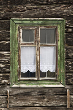 Fototapeta Window with wooden frame in old house