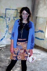 young zombie girl with traces of facial decomposition