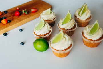 .Cupcakes with cream and lime. Baking.