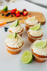 .Cupcakes with cream and lime. Baking.