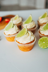 .Cupcakes with cream and lime. Baking.