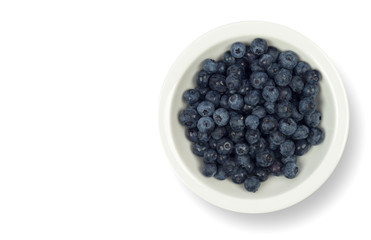 Blueberries on a white plate isolated on a white background. Clipping path and copy space