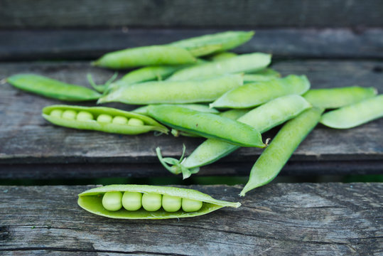green peas wooden background