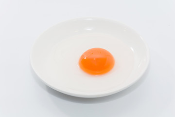 raw duck eggs in plate on white background