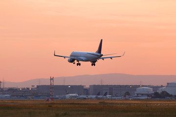 airplane airport landing in a sundown