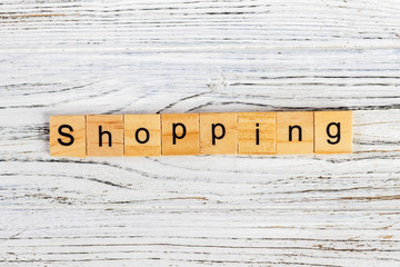 Shopping Word Written In Wooden Cube concept