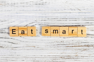 eat smart Word Written In Wooden Cube diet concept