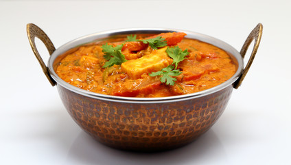 Indian Food or Indian Curry in a copper brass serving bowl. © rakeshpicholiya