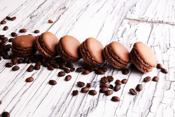 Sweet and colourful french macaroons or macaron with coffee