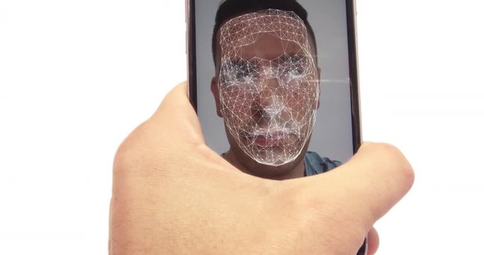 Male using the latest mobile phone with facial recognition and secure software