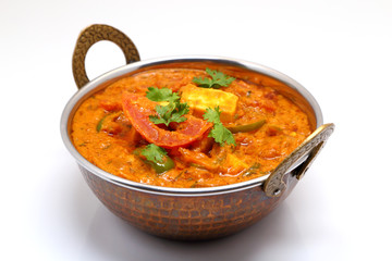 Indian Food or Indian Curry in a copper brass serving bowl.