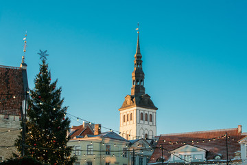 Tallinn, Estonia. Christmas Tree And Church Of St. Nicholas Niguliste