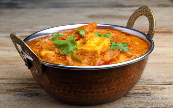 Indian Food or Indian Curry in a copper brass serving bowl.